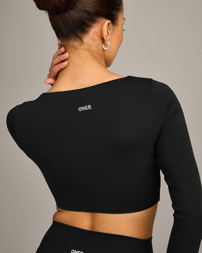 SoftMotion™ Scoop Neck Long Sleeve Crop Top with Built in Bra Shelf with Gray Logo | Black