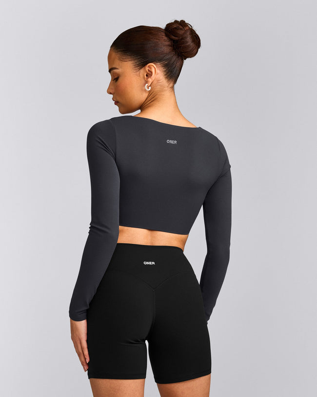 SoftMotion™ Scoop Neck Long Sleeve Crop Top with Built in Bra Shelf with Gray Logo | Coal