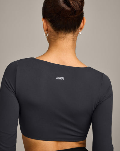 SoftMotion™ Scoop Neck Long Sleeve Crop Top with Built in Bra Shelf with Gray Logo | Coal