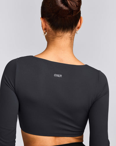 SoftMotion™ Scoop Neck Long Sleeve Crop Top with Built in Bra Shelf with Gray Logo | Coal