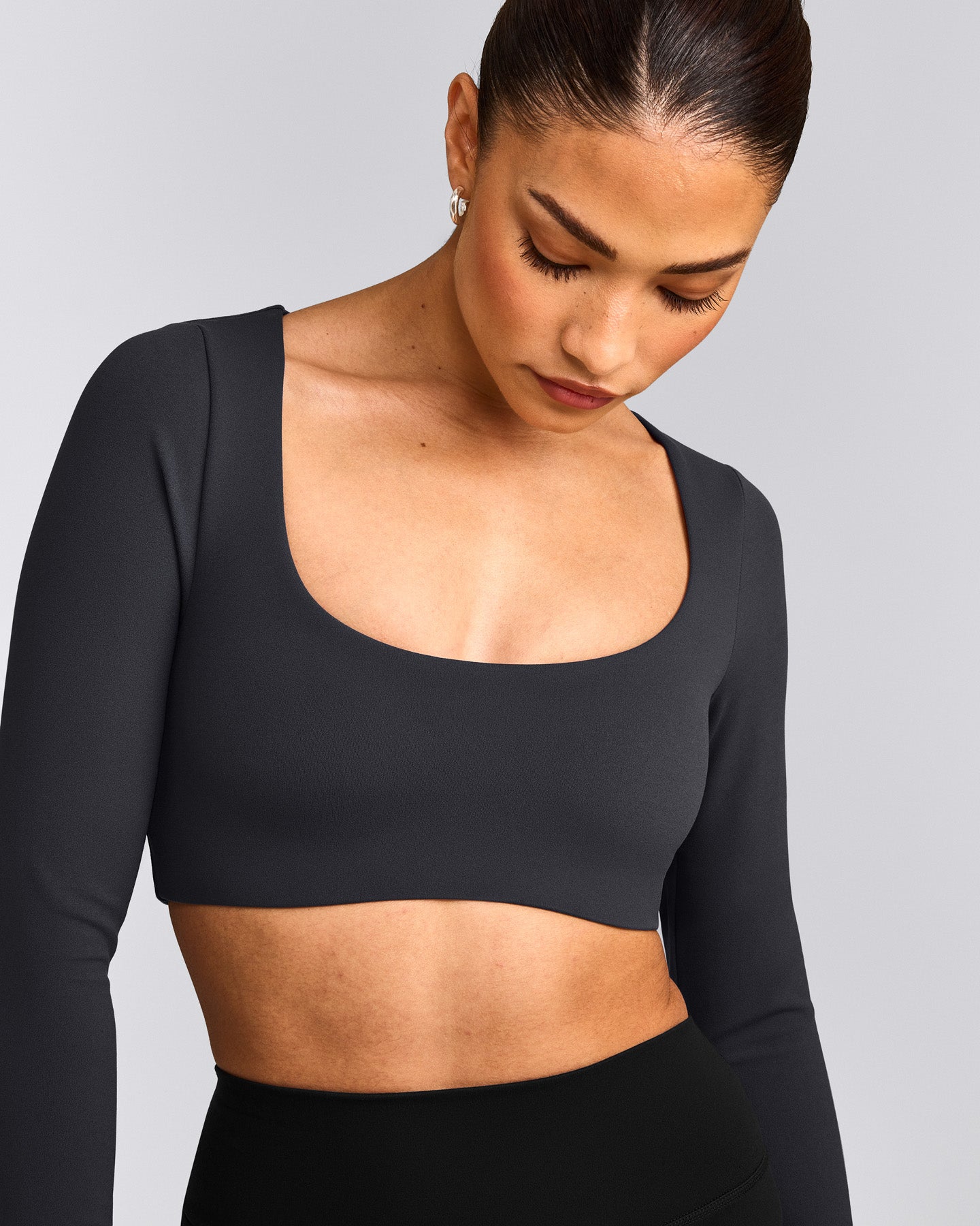 SoftMotion™ Scoop Neck Long Sleeve Crop Top with Built in Bra Shelf with Gray Logo | Coal