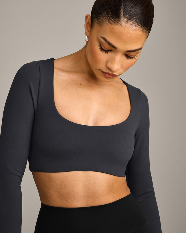 SoftMotion™ Scoop Neck Long Sleeve Crop Top with Built in Bra Shelf with Gray Logo | Coal