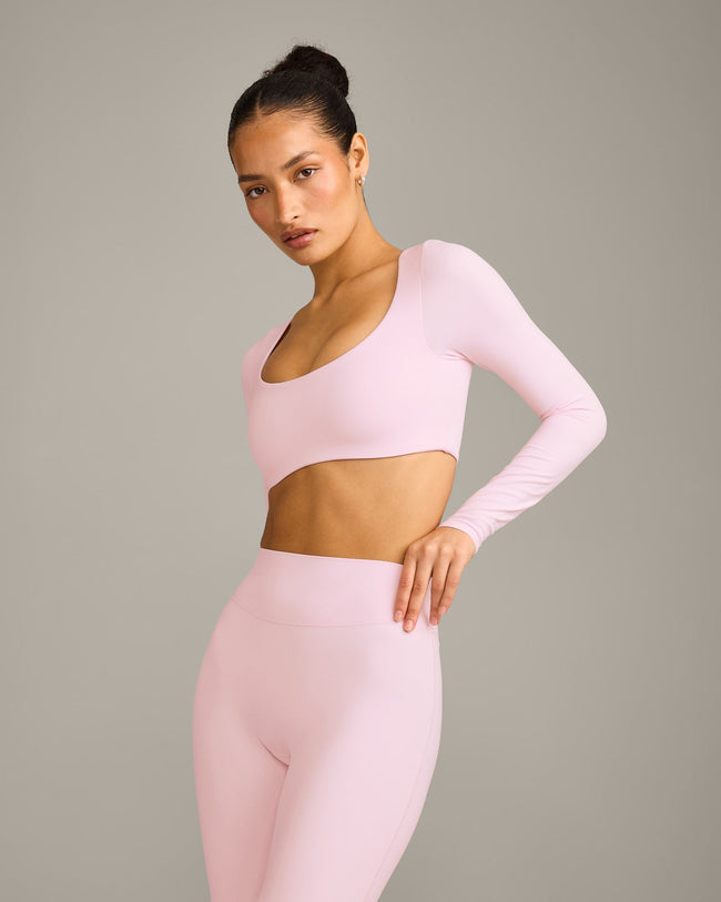SoftMotion™ Scoop Neck Long Sleeve Crop Top with Built in Bra Shelf with Gray Logo | Soft Girl Pink