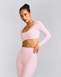 SoftMotion™ Scoop Neck Long Sleeve Crop Top with Built in Bra Shelf with Gray Logo | Soft Girl Pink