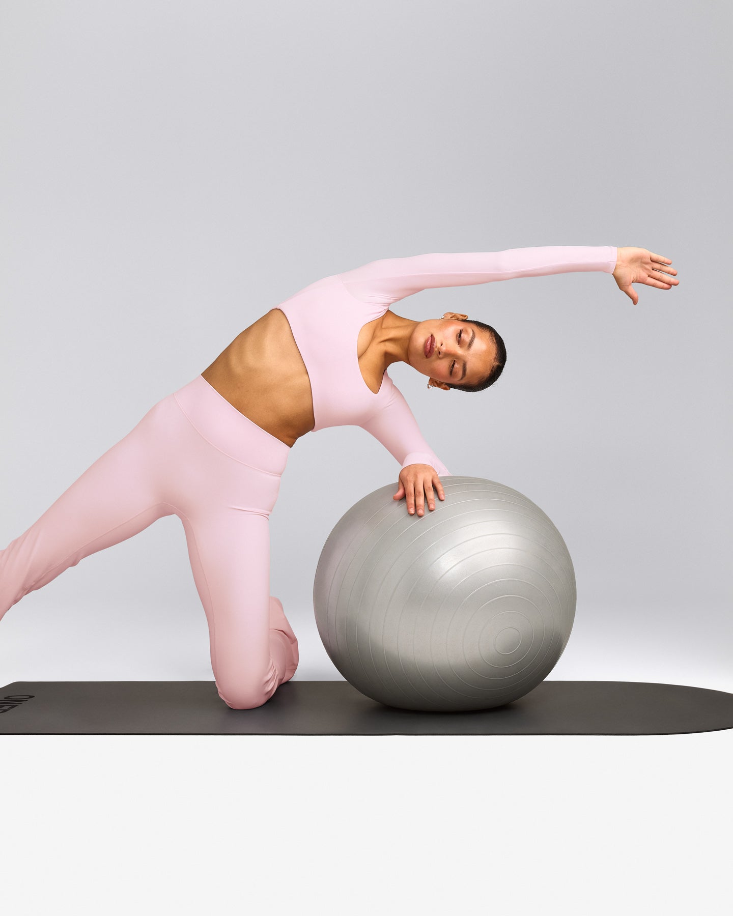 SoftMotion™ Scoop Neck Long Sleeve Crop Top with Built in Bra Shelf with Gray Logo | Soft Girl Pink