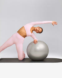 SoftMotion™ Scoop Neck Long Sleeve Crop Top with Built in Bra Shelf with Gray Logo | Soft Girl Pink