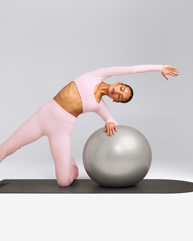 SoftMotion™ Scoop Neck Long Sleeve Crop Top with Built in Bra Shelf with Gray Logo | Soft Girl Pink