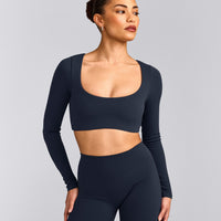 SoftMotion™ Scoop Neck Long Sleeve Crop Top with Built in Bra Shelf with Gray Logo | True Blue