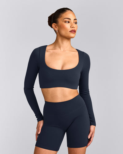 SoftMotion™ Scoop Neck Long Sleeve Crop Top with Built in Bra Shelf with Gray Logo | True Blue