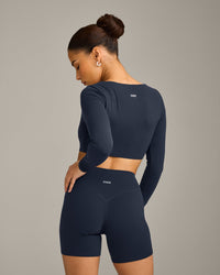 SoftMotion™ Scoop Neck Long Sleeve Crop Top with Built in Bra Shelf with Gray Logo | True Blue