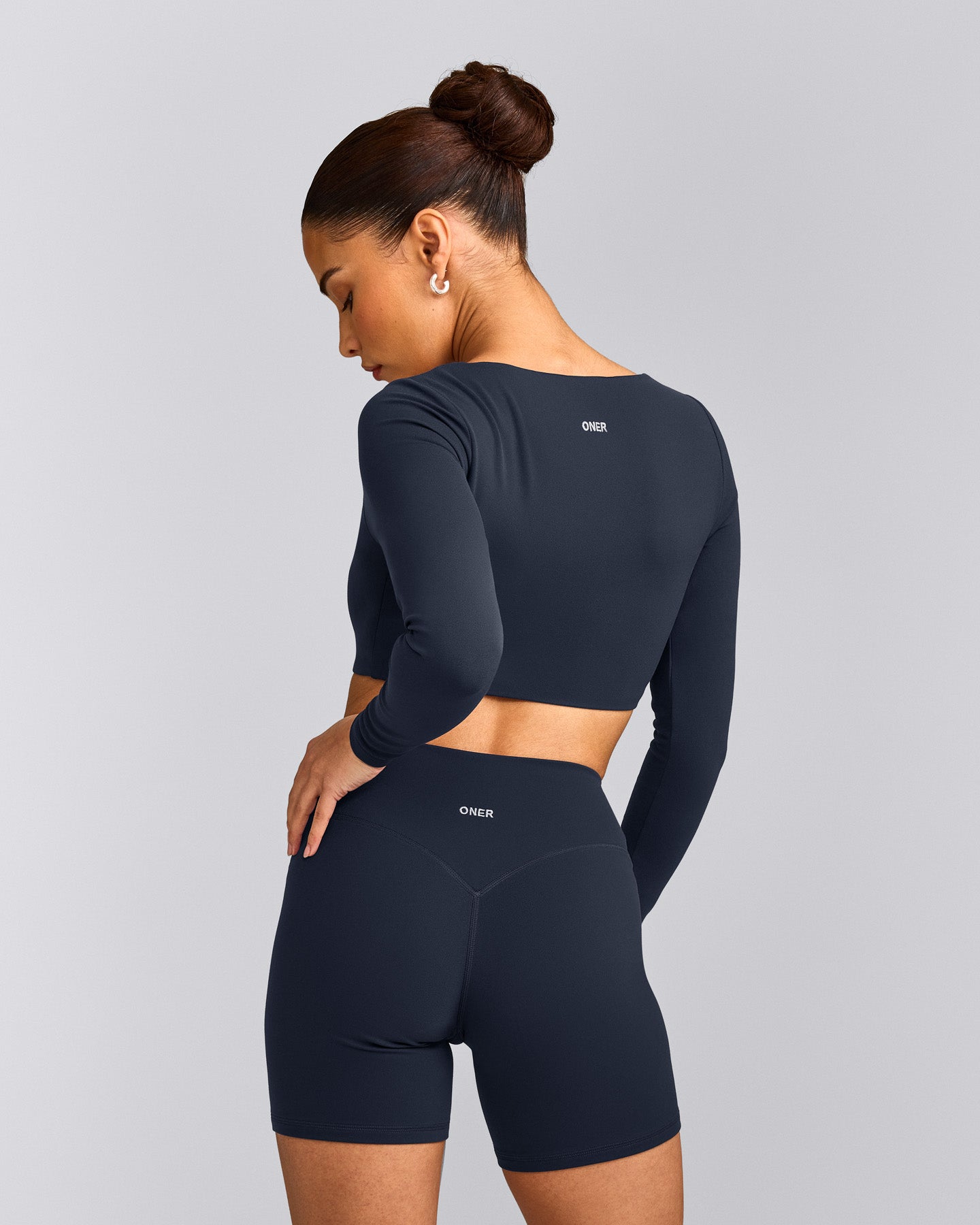 SoftMotion™ Scoop Neck Long Sleeve Crop Top with Built in Bra Shelf with Gray Logo | True Blue