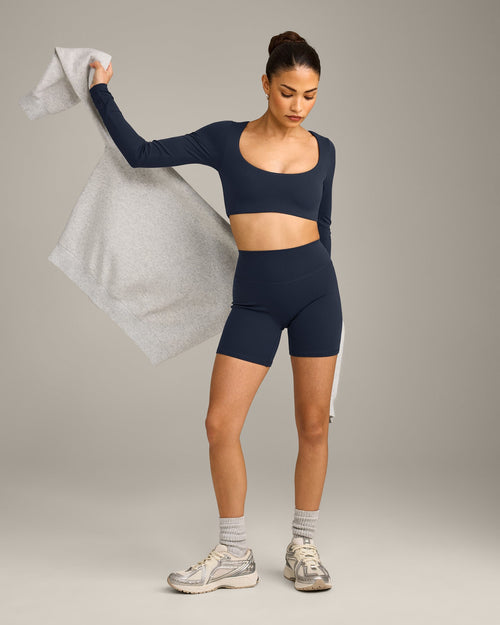 SoftMotion™ Scoop Neck Long Sleeve Crop Top with Built in Bra Shelf with Gray Logo | True Blue