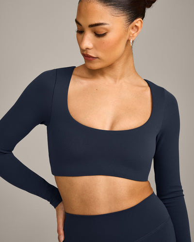 SoftMotion™ Scoop Neck Long Sleeve Crop Top with Built in Bra Shelf with Gray Logo | True Blue