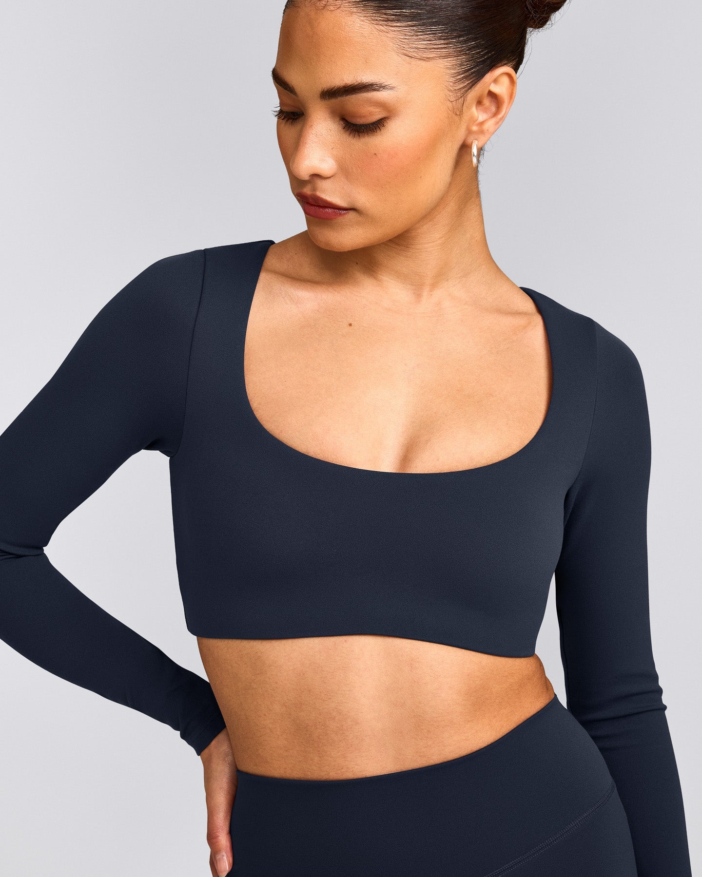 SoftMotion™ Scoop Neck Long Sleeve Crop Top with Built in Bra Shelf with Gray Logo | True Blue