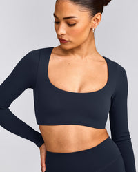 SoftMotion™ Scoop Neck Long Sleeve Crop Top with Built in Bra Shelf with Gray Logo | True Blue