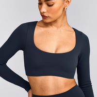SoftMotion™ Scoop Neck Long Sleeve Crop Top with Built in Bra Shelf with Gray Logo | True Blue