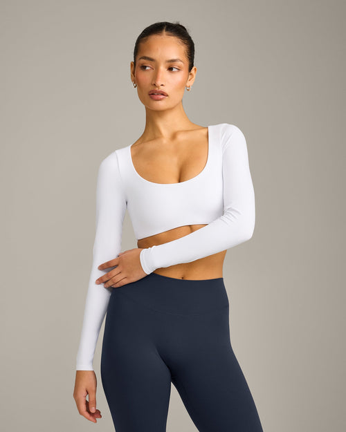 SoftMotion™ Scoop Neck Long Sleeve Crop Top with Built in Bra Shelf with Gray Logo | White