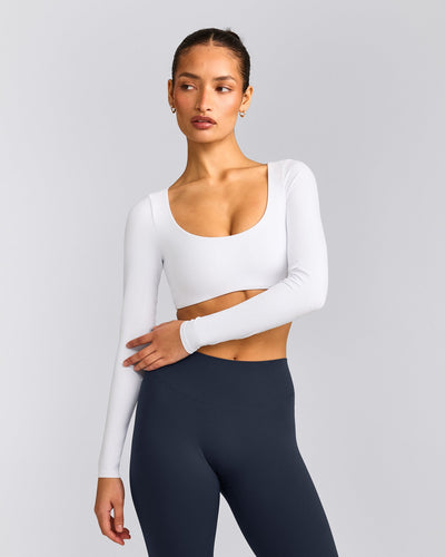 SoftMotion™ Scoop Neck Long Sleeve Crop Top with Built in Bra Shelf with Gray Logo | White