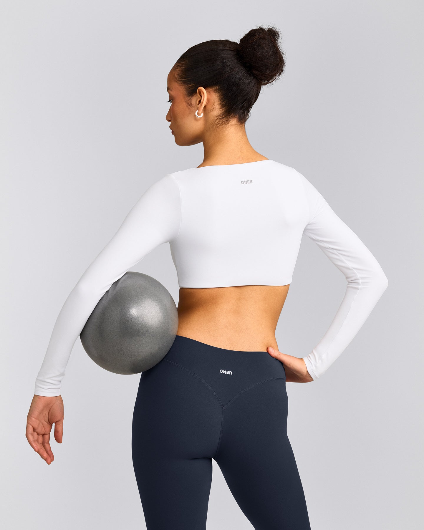SoftMotion™ Scoop Neck Long Sleeve Crop Top with Built in Bra Shelf with Gray Logo | White