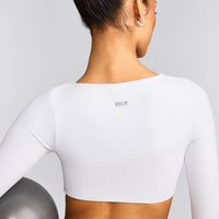 SoftMotion™ Scoop Neck Long Sleeve Crop Top with Built in Bra Shelf with Gray Logo | White
