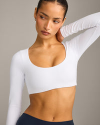 SoftMotion™ Scoop Neck Long Sleeve Crop Top with Built in Bra Shelf with Gray Logo | White