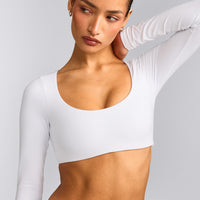 SoftMotion™ Scoop Neck Long Sleeve Crop Top with Built in Bra Shelf with Gray Logo | White
