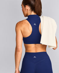 EasyLift™ Zip High Neck Sports Bra with Gray Logo | Varsity Blue