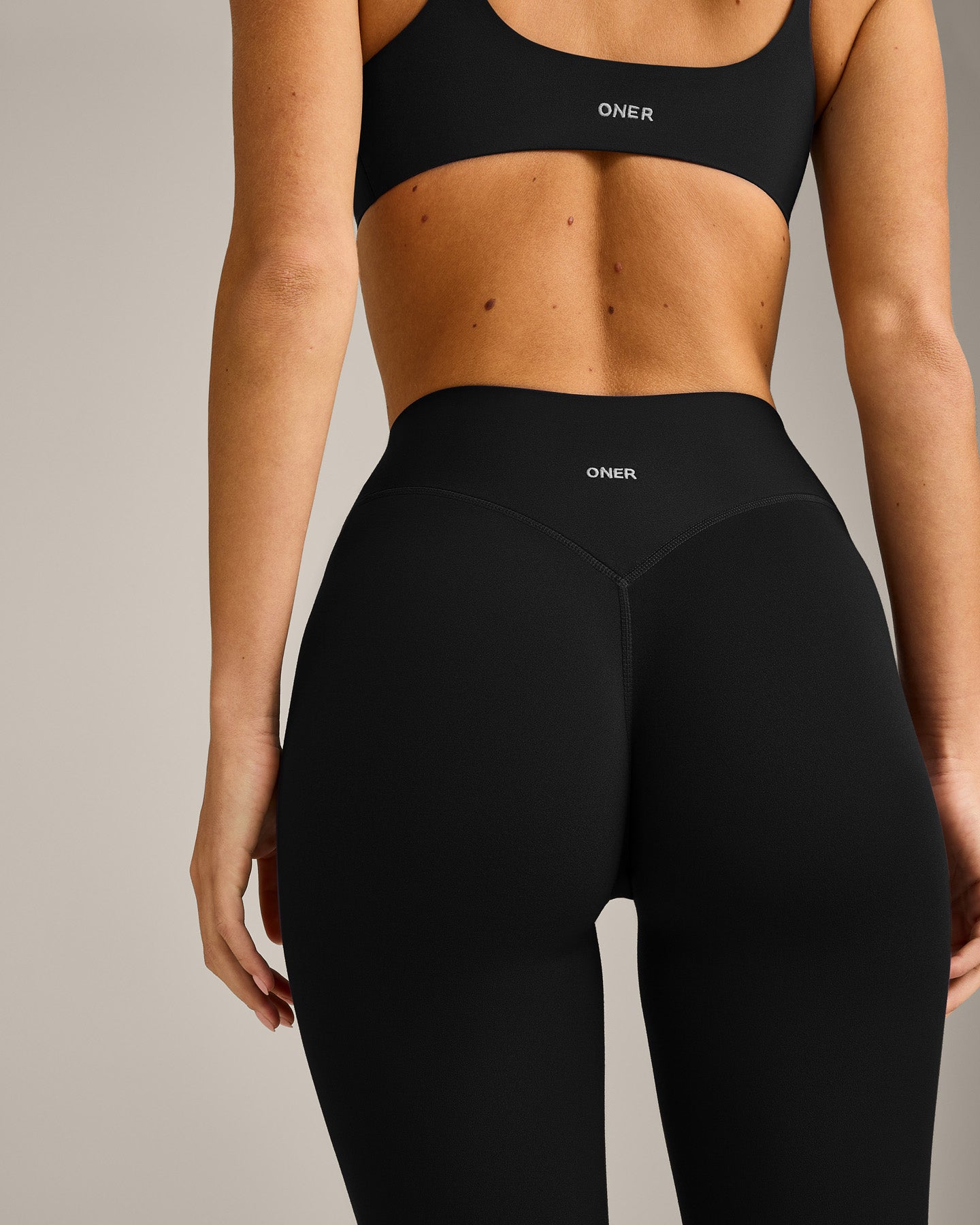 SoftMotion™ 3/4 Length Leggings with Gray Logo | Black