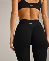 SoftMotion™ 3/4 Length Leggings with Gray Logo | Black