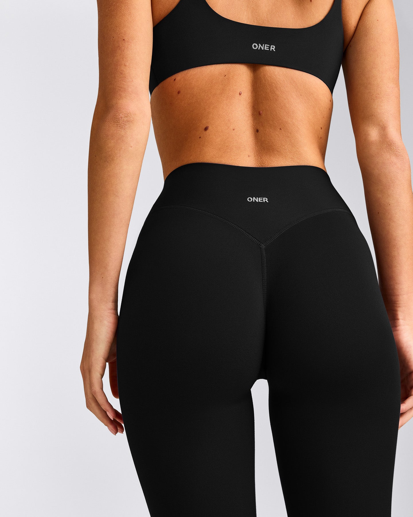 SoftMotion™ 3/4 Length Leggings with Gray Logo | Black