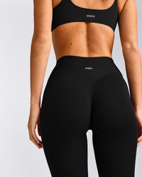 SoftMotion™ 3/4 Length Leggings with Gray Logo | Black