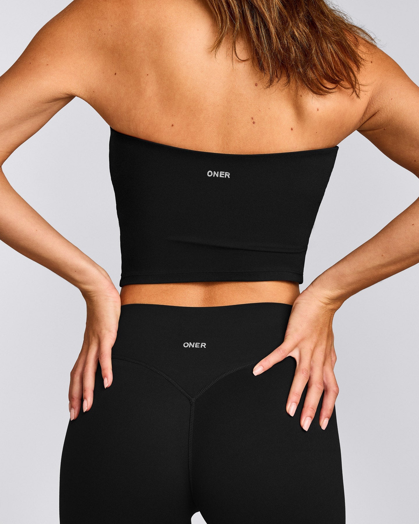 SoftMotion™ Bandeau Mid Tank Top with Built in Bra Shelf with Gray Logo | Black