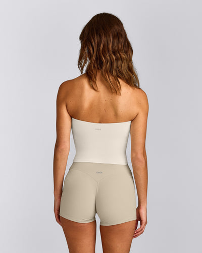 SoftMotion™ Bandeau Mid Tank Top with Built in Bra Shelf with Gray Logo | Marshmallow White