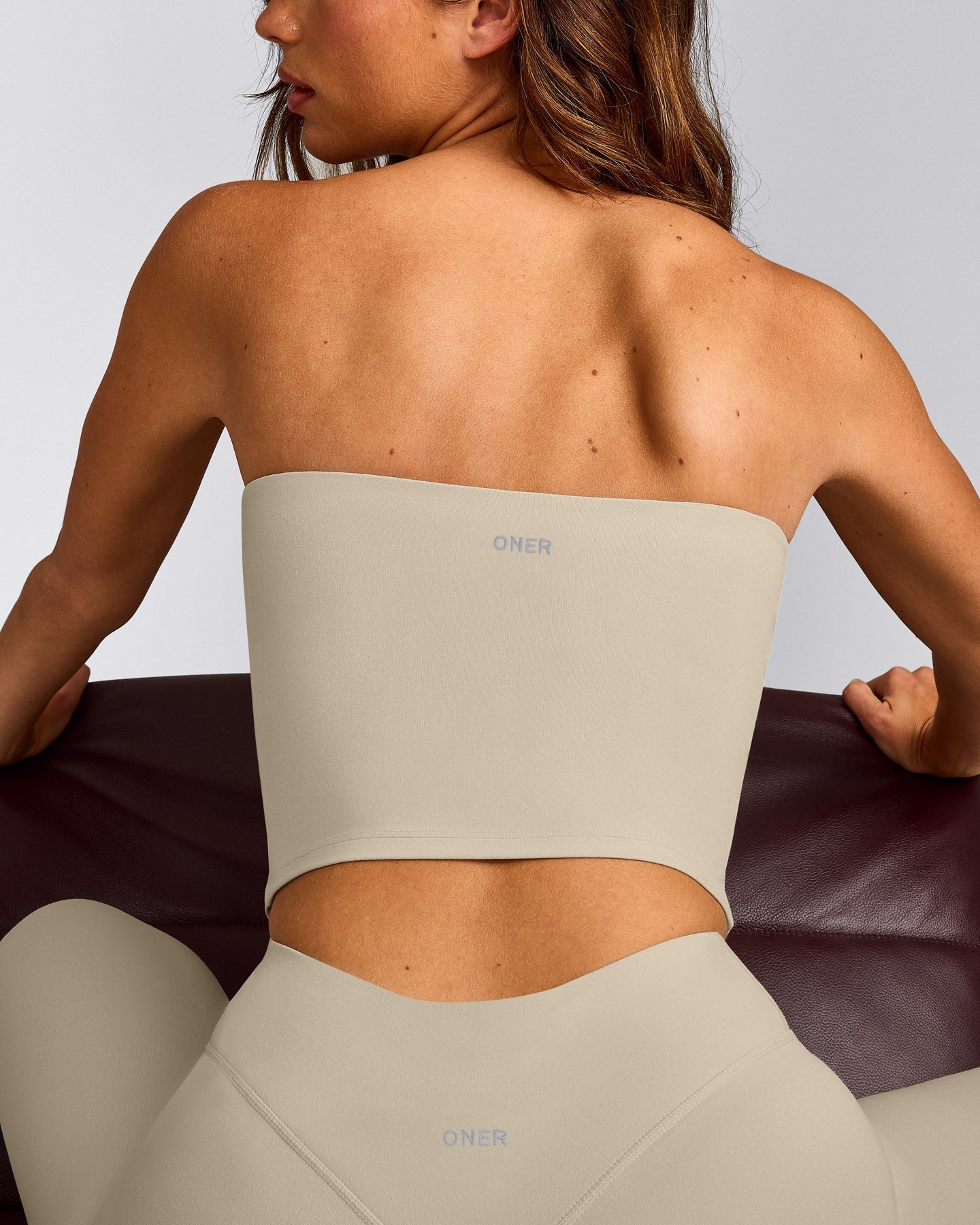 SoftMotion™ Bandeau Mid Tank Top with Built in Bra Shelf with Gray Logo | Oatmeal
