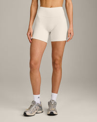 SoftMotion™ Double Layer High Waisted Shorts 6" with Gray Logo | Marshmallow White