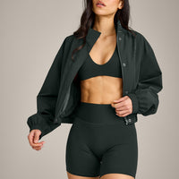 SoftMotion™ Minimal Halter Neck Bralette with Gray Logo | Emerald Noir