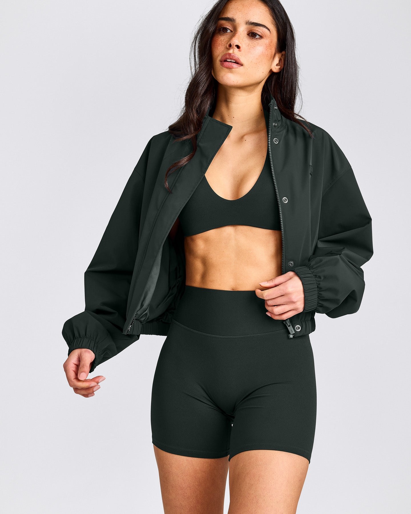 SoftMotion™ Minimal Halter Neck Bralette with Gray Logo | Emerald Noir