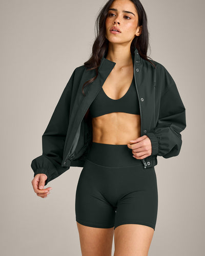 SoftMotion™ Minimal Halter Neck Bralette with Gray Logo | Emerald Noir