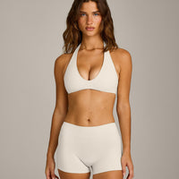 SoftMotion™ Minimal Halter Neck Bralette with Gray Logo | Marshmallow White