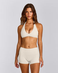 SoftMotion™ Minimal Halter Neck Bralette with Gray Logo | Marshmallow White