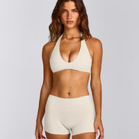 SoftMotion™ Minimal Halter Neck Bralette with Gray Logo | Marshmallow White