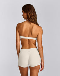 SoftMotion™ Minimal Halter Neck Bralette with Gray Logo | Marshmallow White