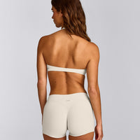 SoftMotion™ Minimal Halter Neck Bralette with Gray Logo | Marshmallow White