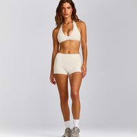 SoftMotion™ Minimal Halter Neck Bralette with Gray Logo | Marshmallow White