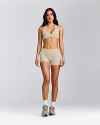 SoftMotion™ Minimal Halter Neck Bralette with Gray Logo | Oatmeal