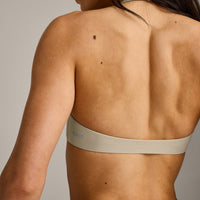 SoftMotion™ Minimal Halter Neck Bralette with Gray Logo | Oatmeal