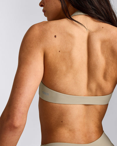 SoftMotion™ Minimal Halter Neck Bralette with Gray Logo | Oatmeal