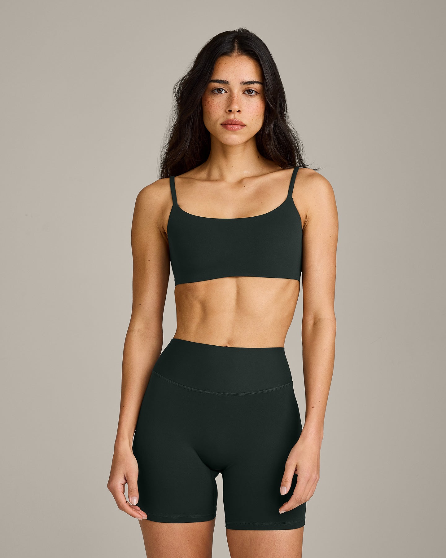 SoftMotion™ Strappy Sports Bra with Gray Logo | Emerald Noir