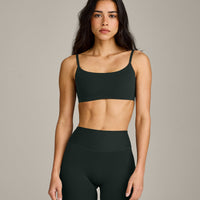 SoftMotion™ Strappy Sports Bra with Gray Logo | Emerald Noir