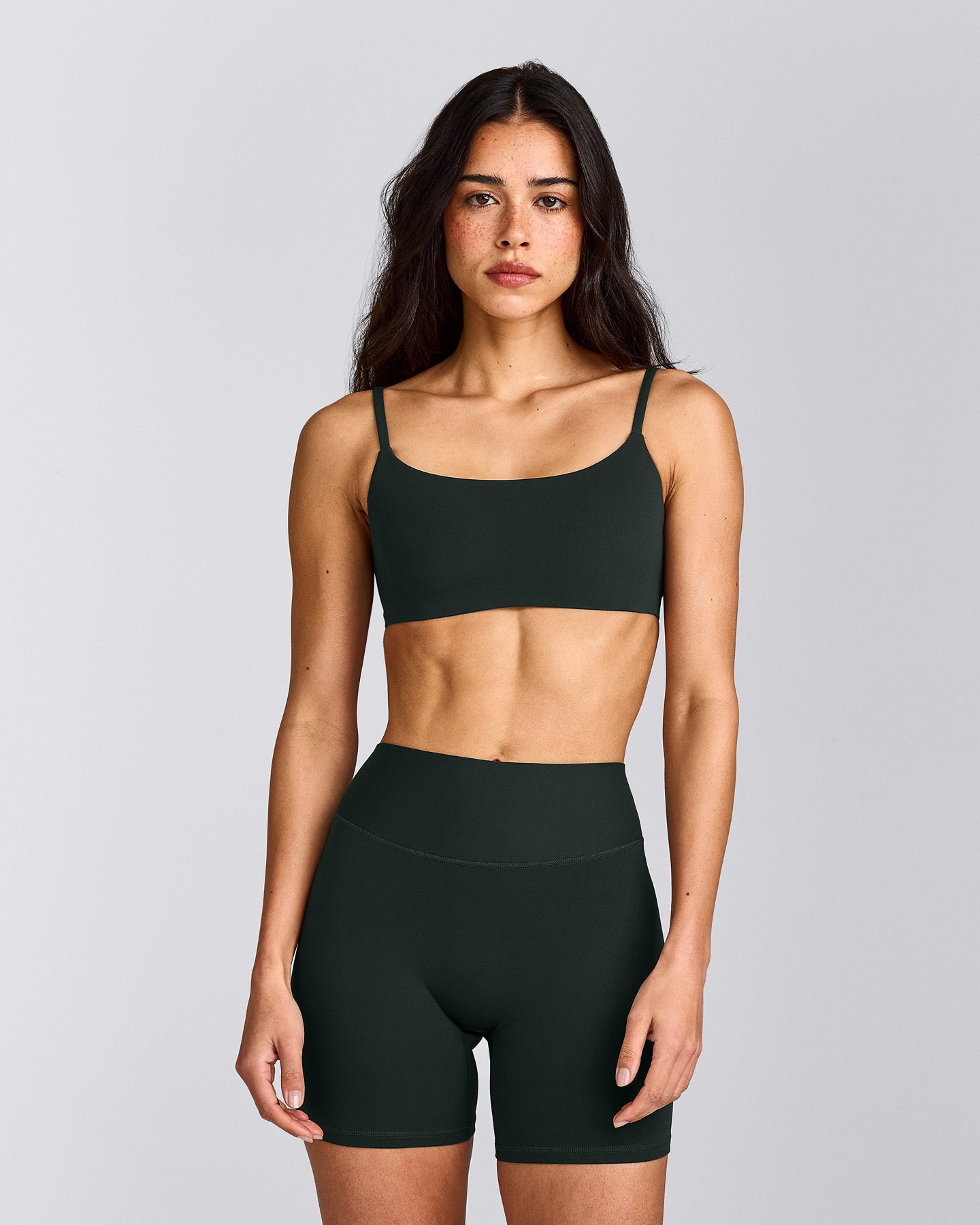 SoftMotion™ Strappy Sports Bra with Gray Logo | Emerald Noir